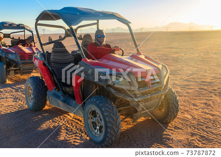 Safari trip through egyptian desert driving buggy cars Safari trip through egyptian desert driving buggy cars 73787872