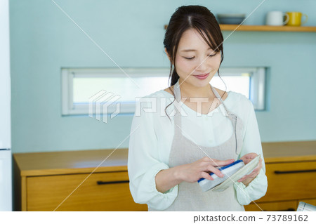 Woman washing dishes Housework 73789162