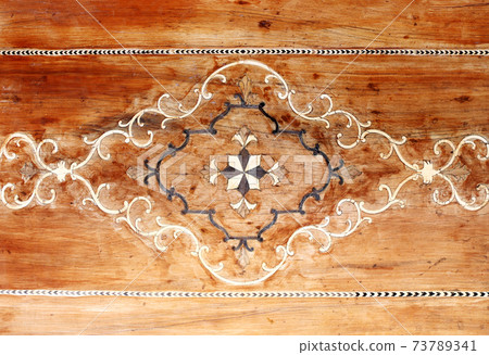 Detail of wooden wall panel with wood carving floral ornament, Shiraz, Iran 73789341