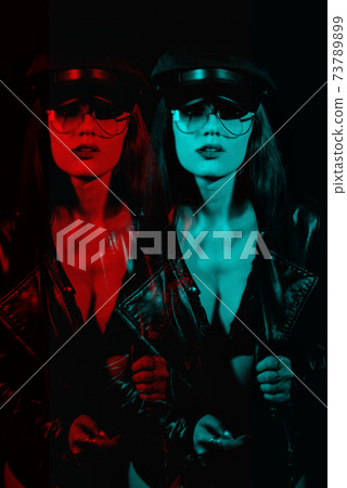 portrait of a sexy girl with glasses in a leather jacket and cap portrait of a sexy girl with glasses in a leather jacket and cap 73789899