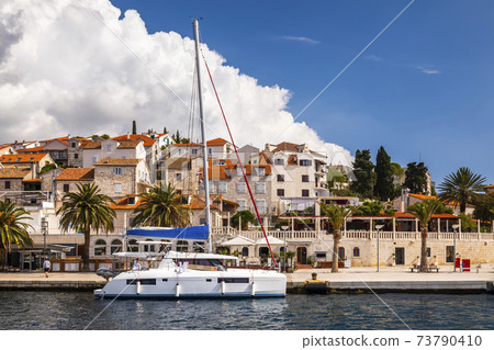 View of the embankment of Hvar at sunny day. Hvar island, Croatia. View of the embankment of Hvar at sunny day. Hvar island, Croatia. 73790410