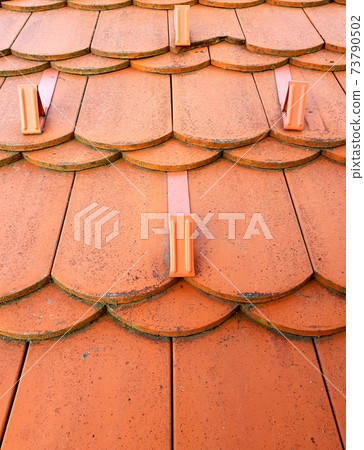 Closeup of roof tiles 73790502