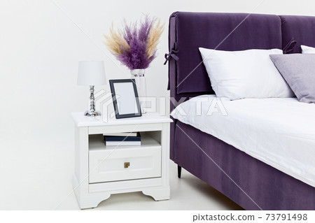 Interior bedside tables near the beds Interior bedside tables near the beds 73791498