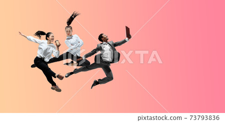 Happy office workers jumping and dancing in casual clothes or suit on gradient neon fluid background. Flyer with copyspace 73793836