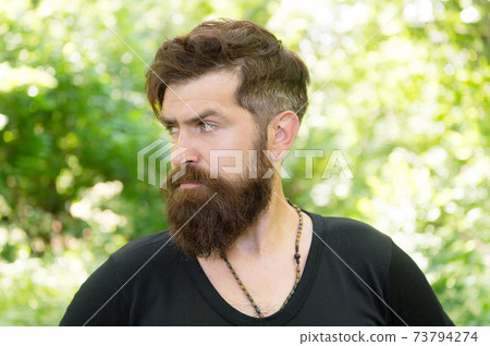 Wilderness survival guide. Man bearded hipster bright Wilderness survival guide. Man bearded hipster bright 73794274