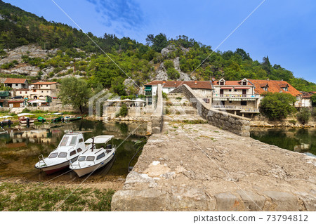 Old Bridge in Rijeka Crnojevica River near Skadar Lake - Montenegro 73794812