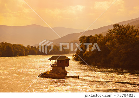 House on rock island in river Drina - Serbia 73794825