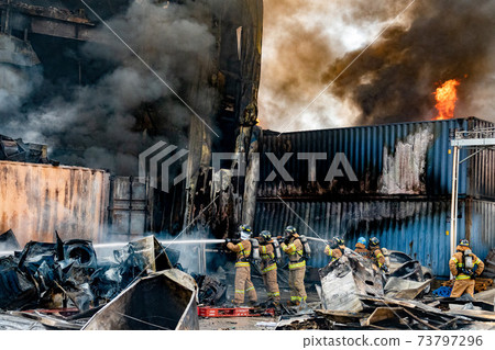 Firefighters working on the field 73797296