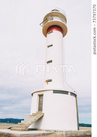 lighthouse on the lonely beach of delta del ebro, tarragona, spain. 73797370