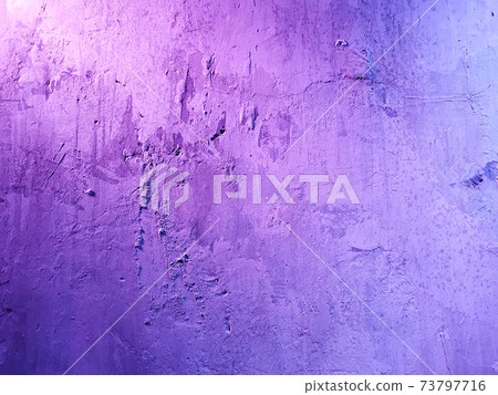 Texture of rough stucco wall with decorative purple light. Decorative plaster on the wall. 73797716
