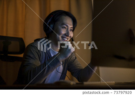 Gamer man rejoices to win Gamer man rejoices to win 73797920