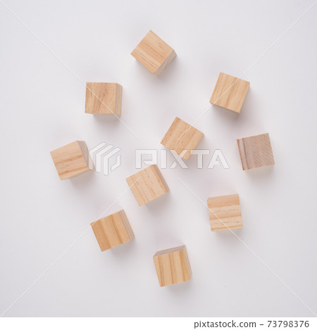 Row of ten blank wooden blocks on a white background with copyspace for your text, letters or numbers. Row of ten blank wooden blocks on a white background with copyspace for your text, letters or numbers. 73798376