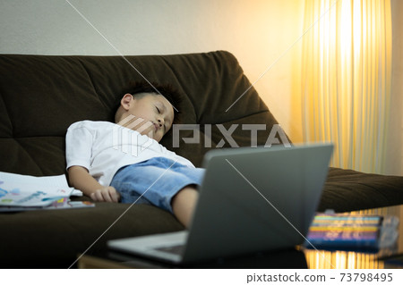 Online education problems,asian schoolboy student sleeping while studying homework online with laptop computer at home,during quarantine,distance education,distance learning for kids,new normal life Online education problems,asian schoolboy student sleeping while studying homework online with laptop computer at home,during quarantine,distance education,distance learning for kids,new normal life 73798495