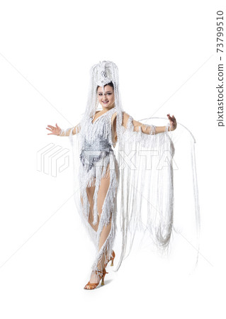 Beautiful young woman in carnival, stylish masquerade costume with feathers dancing on white studio background. Concept of holidays celebration, festive time, fashion Beautiful young woman in carnival, stylish masquerade costume with feathers dancing on white studio background. Concept of holidays celebration, festive time, fashion 73799510
