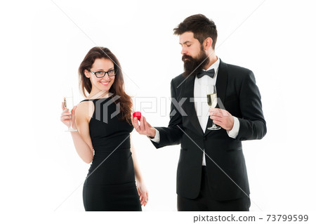 proposal of marriage. bearded man in tuxedo makes  73799599