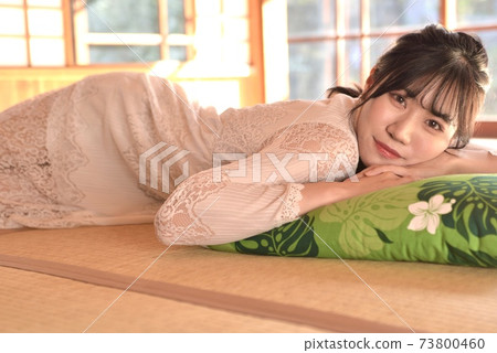 A young and beautiful woman posing in a Japanese-style room in an old folk house A young and beautiful woman posing in a Japanese-style room in an old folk house 73800460