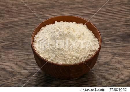 Wheat flour heap in the bowl Wheat flour heap in the bowl 73801052