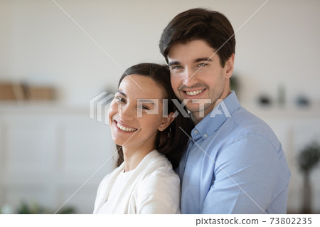 Head shot portrait smiling man hugging woman, posing for photo Head shot portrait smiling man hugging woman, posing for photo 73802235