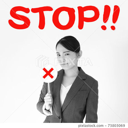 Image of business woman emphasizing STOP Image of business woman emphasizing STOP 73803069