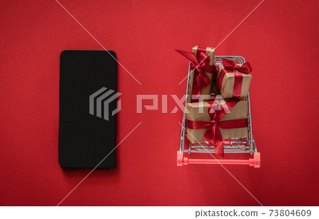 Online shopping for Valentine's day concept - presents in shopping cart 73804609