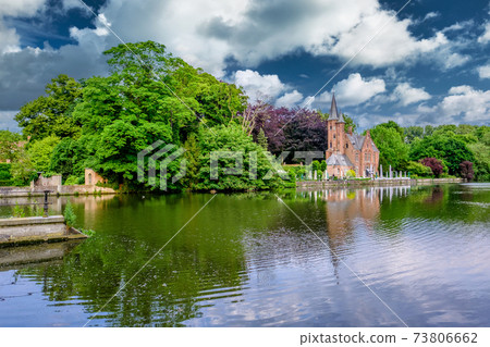 Bruges (Brugge) cityscape with Minnewater lake 73806662