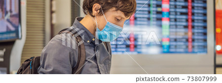 Man traveler with medical face mask to protection the coronavirus in airport BANNER, LONG FORMAT Man traveler with medical face mask to protection the coronavirus in airport BANNER, LONG FORMAT 73807999