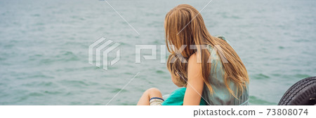 BANNER, LONG FORMAT Mom and son travelers is traveling by boat in Halong Bay. Vietnam. Travel to Asia, happiness emotion, summer holiday concept. Traveling with children concept. After COVID 19 BANNER, LONG FORMAT Mom and son travelers is traveling by boat in Halong Bay. Vietnam. Travel to Asia, happiness emotion, summer holiday concept. Traveling with children concept. After COVID 19 73808074
