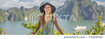 BANNER, LONG FORMAT Attractive woman in a dress is traveling in Halong Bay. Vietnam. Travel to Asia, happiness emotion, summer holiday concept. Picturesque sea landscape. Ha Long Bay, Vietnam BANNER, LONG FORMAT Attractive woman in a dress is traveling in Halong Bay. Vietnam. Travel to Asia, happiness emotion, summer holiday concept. Picturesque sea landscape. Ha Long Bay, Vietnam 73808084