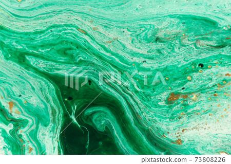Green marble abstract acrylic background. Marbling artwork texture. Agate ripple pattern. Gold powder. Green marble abstract acrylic background. Marbling artwork texture. Agate ripple pattern. Gold powder. 73808226