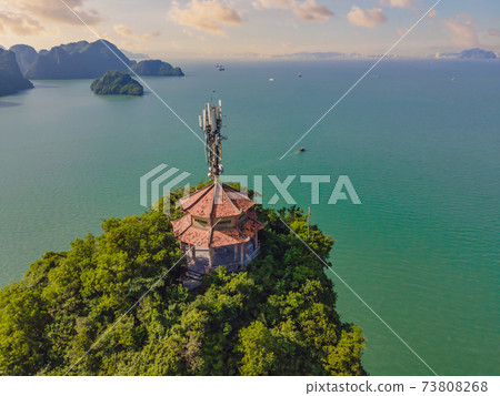 Aerial view panorama of floating fishing village and rock island, Halong Bay, Vietnam, Southeast Asia. UNESCO World Heritage Site. Junk boat cruise to Ha Long Bay. Popular landmark of Vietnam Aerial view panorama of floating fishing village and rock island, Halong Bay, Vietnam, Southeast Asia. UNESCO World Heritage Site. Junk boat cruise to Ha Long Bay. Popular landmark of Vietnam 73808268