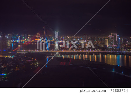 The architecture shimmering under the night-lit city makes the city more vibrant in Da Nang, Vietnam 73808724