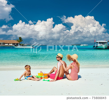 Family with three year old boy on beach Family with three year old boy on beach 73808843