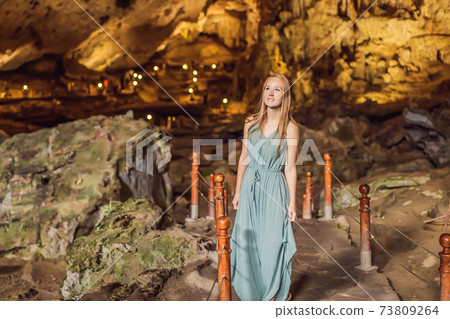 Woman tourist in Hang Sung Sot Grotto Cave of Surprises, Halong Bay, Vietnam 73809264