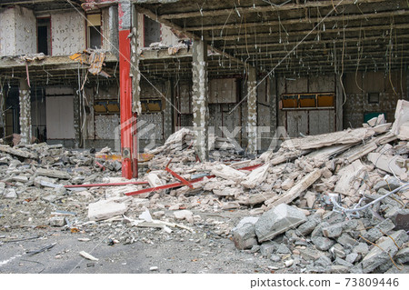 Large piles of rubble at a demolition site 73809446