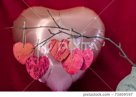 Heart shaped branch with leaves from tree bark 73809597