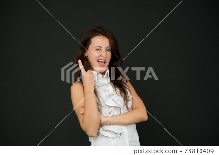 funny lady with cool gesture having long brunette hair funny lady with cool gesture having long brunette hair 73810409