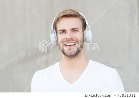 Music makes my day. Happy man listen to music grey  73811311
