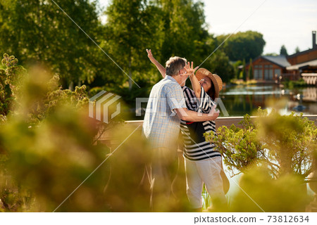 Hugging mature couple. Hugging mature couple. 73812634