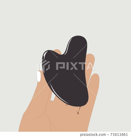 Hand holding Gua Sha massage tool. The Black Obsidian Facial Lifting scraper. Vector color illustration template. 73813861