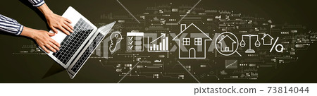 Real estate theme with person using laptop 73814044