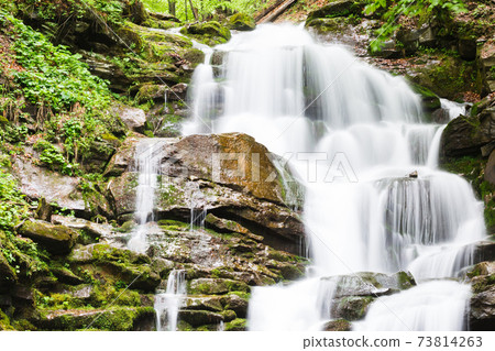 small waterfall of mountain river 73814263