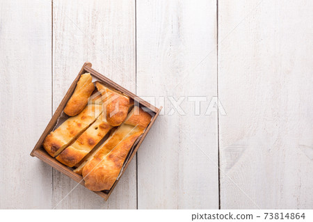 Traditional national Georgian Shoti bread on a white wooden background. Traditional national Georgian Shoti bread on a white wooden background. 73814864