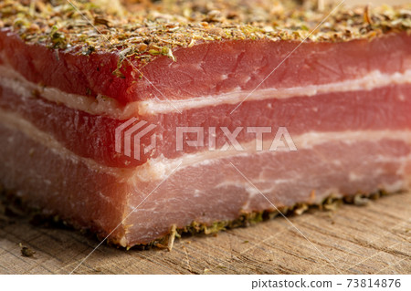 Appetizer cured pork belly in spices of herbs. 73814876