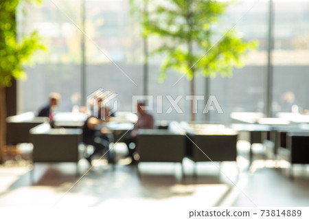 Blur image of open space for negotiations and relaxation with big window. Blur image of open space for negotiations and relaxation with big window. 73814889