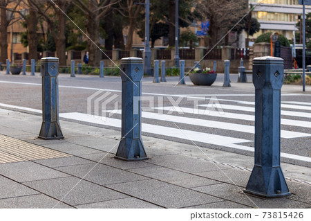 A bollard to avoid cars on the sidewalk, stop entering cars 73815426