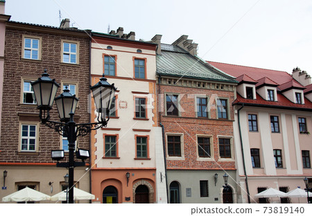 Masonry buildings facades in Krakow old town Masonry buildings facades in Krakow old town 73819140