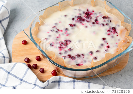 Homemade cranberry and sour cream pie in a glass baking dish Homemade cranberry and sour cream pie in a glass baking dish 73820196