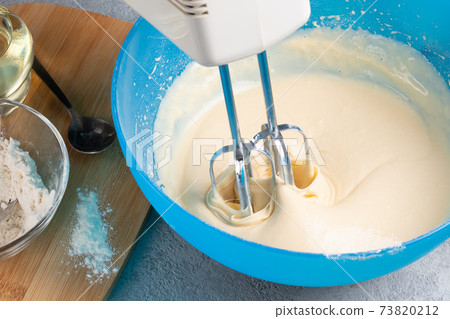 Kneading baking dough with an electric mixer Kneading baking dough with an electric mixer 73820212