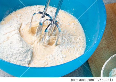 Kneading baking dough with an electric mixer Kneading baking dough with an electric mixer 73820213