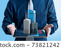 Businessman show 3d real estate building for investment on tablet screen. 73821242